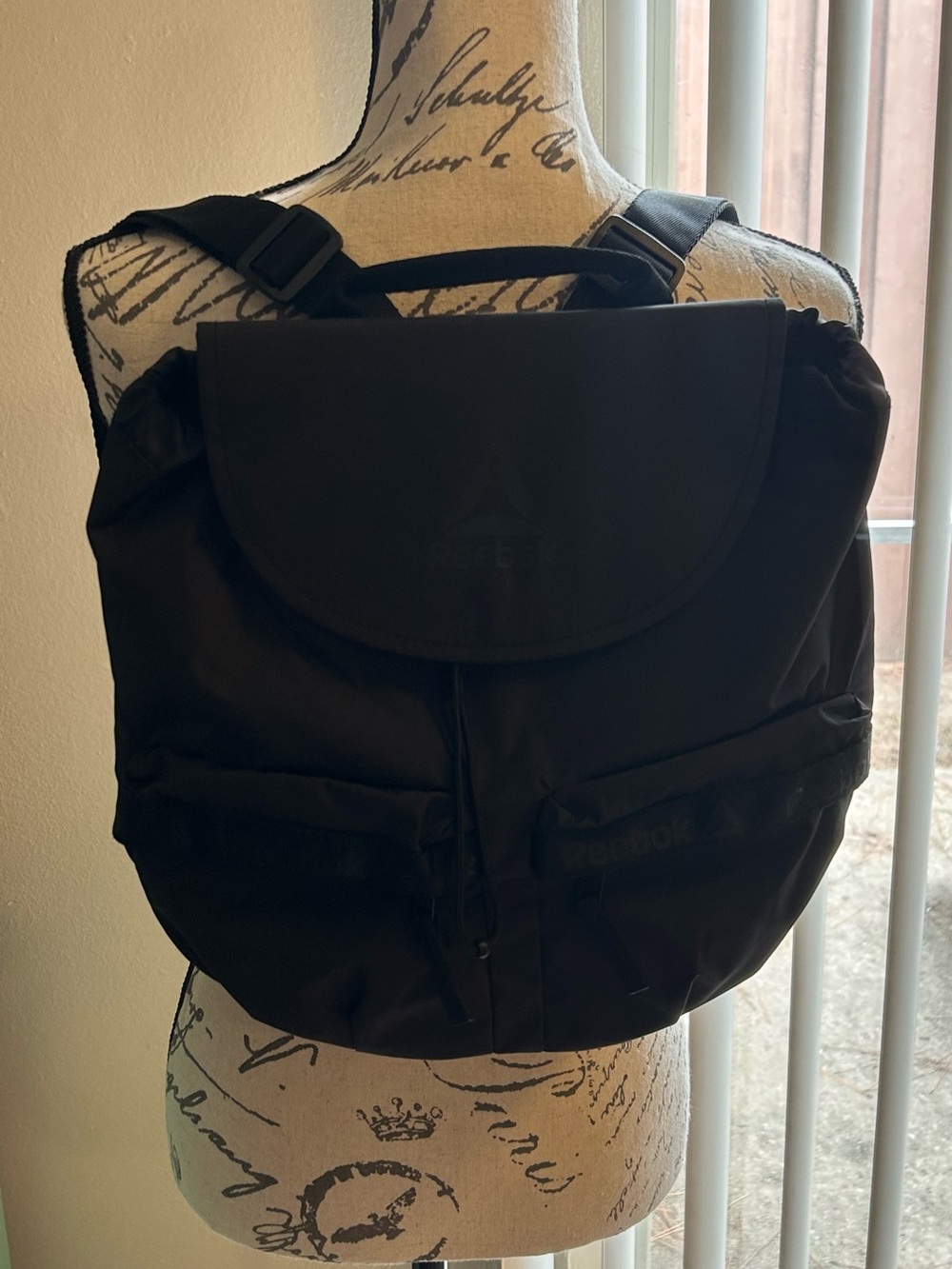 Reebok Women's Teegan Mini Backpack Black Nylon Drawstring Flap Bag Very Good